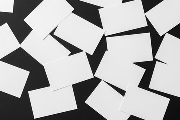 Mockup of scattered white business cards stacks arranged in rows
