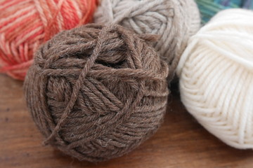 Fototapeta na wymiar Colorful woolen balls with knitting needles