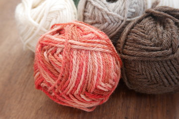 Colorful woolen balls with knitting needles