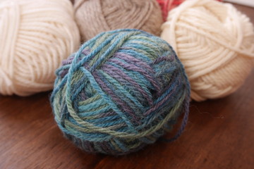 Colorful woolen balls with knitting needles