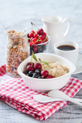 porridge with berries on a table, selective focus