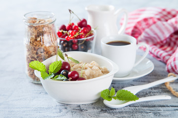 porridge with berries on a table, selective focus