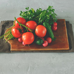Various fresh vegetables on the light surface
