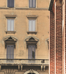 old face of a building in Milan, Italy