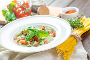 Ravioli pasta from green dough stuffing