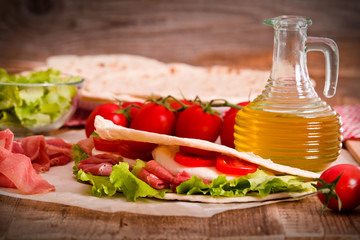 Piadina with ham and lettuce.