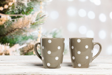 Coffee cups on wooden table