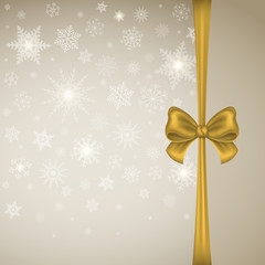 Winter Christmas Background card or banner. New Year. Gold satin bow with ribbon on a background of snowflakes.