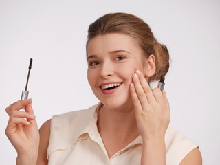 Woman with mascara. Emotion - happynes. 