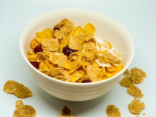 The breakfast cereal topped with dried fruit.