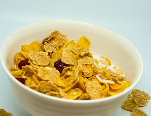 The breakfast cereal topped with dried fruit.