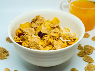 The breakfast cereal topped with dried fruit.