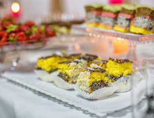 Different delicious desserts and cakes on table