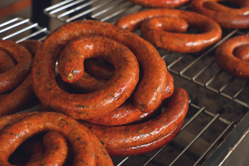 Asgaew or Northern Thai sausage grill on the stove