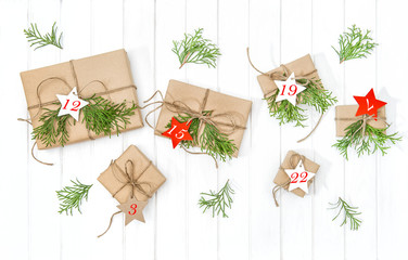Fototapeta na wymiar Wrapped gifts Advent calendar christmas tree branches decoration