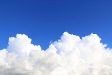 Fototapeta na wymiar huge white cloud on blue sky background