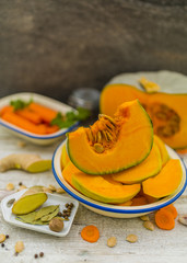 Portions pumpkin on the table in the kitchen ready to cook.