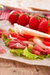 Piadina with ham and lettuce.