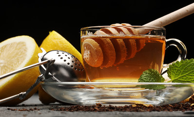 Ginger tea with lemon. Mint leaf. Mint leaves. Tea in a glass cup, mint leaves, dried tea, sliced...