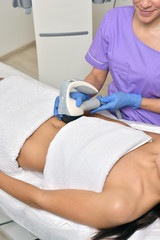 Beauty treatment of a young woman in specialized healt care clinic