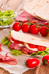 Piadina with ham and lettuce.