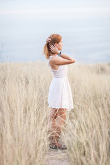 Portrait of the beautiful girl on nature