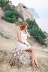 Portrait of the beautiful girl on nature