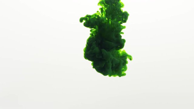 green ink poured in water in slow motion, 180fps prores footage