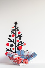 Washi tape christmas tree decoration and basket of christmas gifts with copy space. Christmas background.