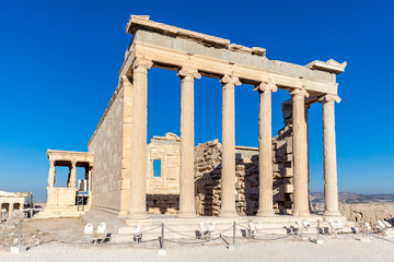 Fototapeta premium Erechtheum temple with caryatid porch on the Acropolis in Athens, Greece