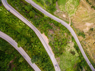 Aerial view of crooked path of road on the mountain, Shot from d
