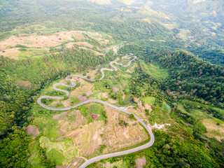 Aerial view of crooked path of road on the mountain, Shot from d