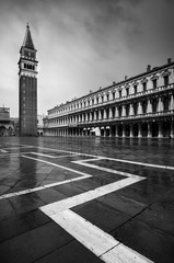 San Marco square with Campanile and Saint Mark's Basilica during rainy morning. Venice, Italy.