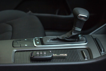 Fototapeta na wymiar Car remote control key in vehicle interior