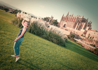 Fototapeta premium Independent woman on vacation in Palma de Mallorca with her red