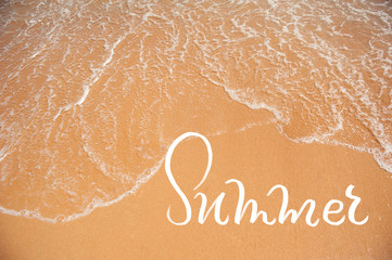 Wave of sea on the sand beach and word Summer. calligraphy lettering