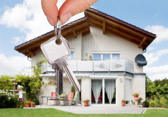 Person Holding The House Key