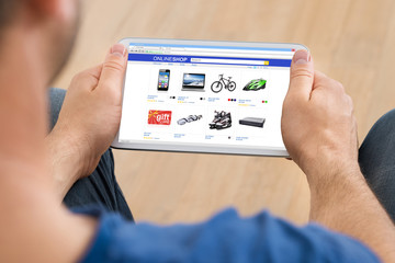 Person Shopping Online On Digital Tablet