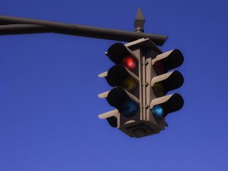 Traffic signals with a blue sky
