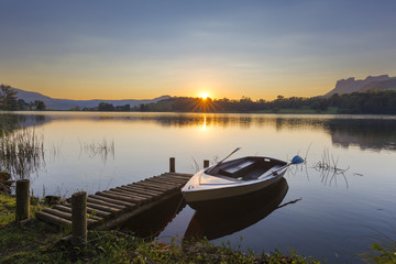 Fototapeta na wymiar Reflection of sunrise on water