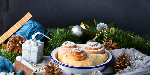 Cinnamon roll buns and Christmas decorations. Banner