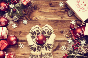 Set of colorful Christmas gifts lying on a table and  female han