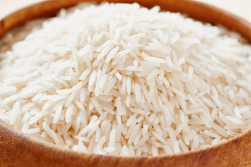 Basmati rice and brown rice on spoon