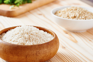 Basmati rice and brown rice on spoon