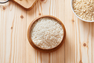 Basmati rice and brown rice on spoon