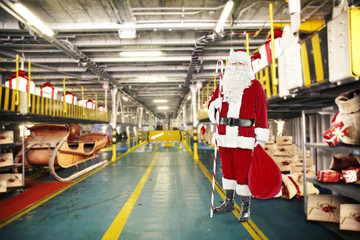santa claus and elf in interior 