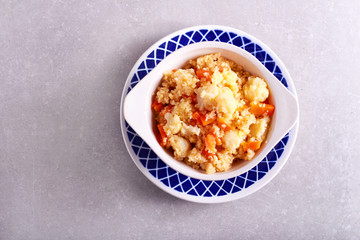 cauliflower and carrot couscous in a bowl