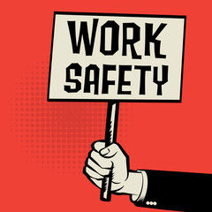 Poster in hand, business concept with text Work Safety