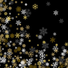 Snowfall background with golden snowflakes blurred in the dark