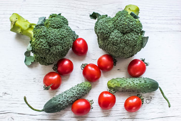 Fresh Raw Broccoli, Cheery tomatoes and cucumbers.Vegetables